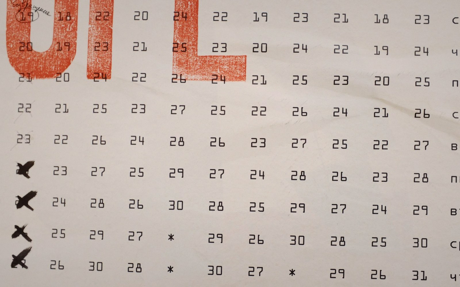 Grid of printed calendar numbers with bird silhouette icons marking select rows