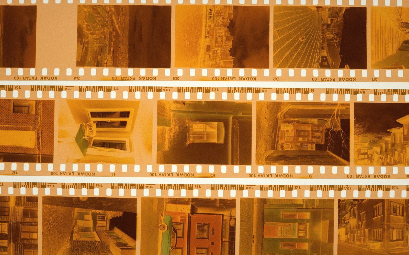 Strips of Kodak film negatives showing rows of small building and street photos